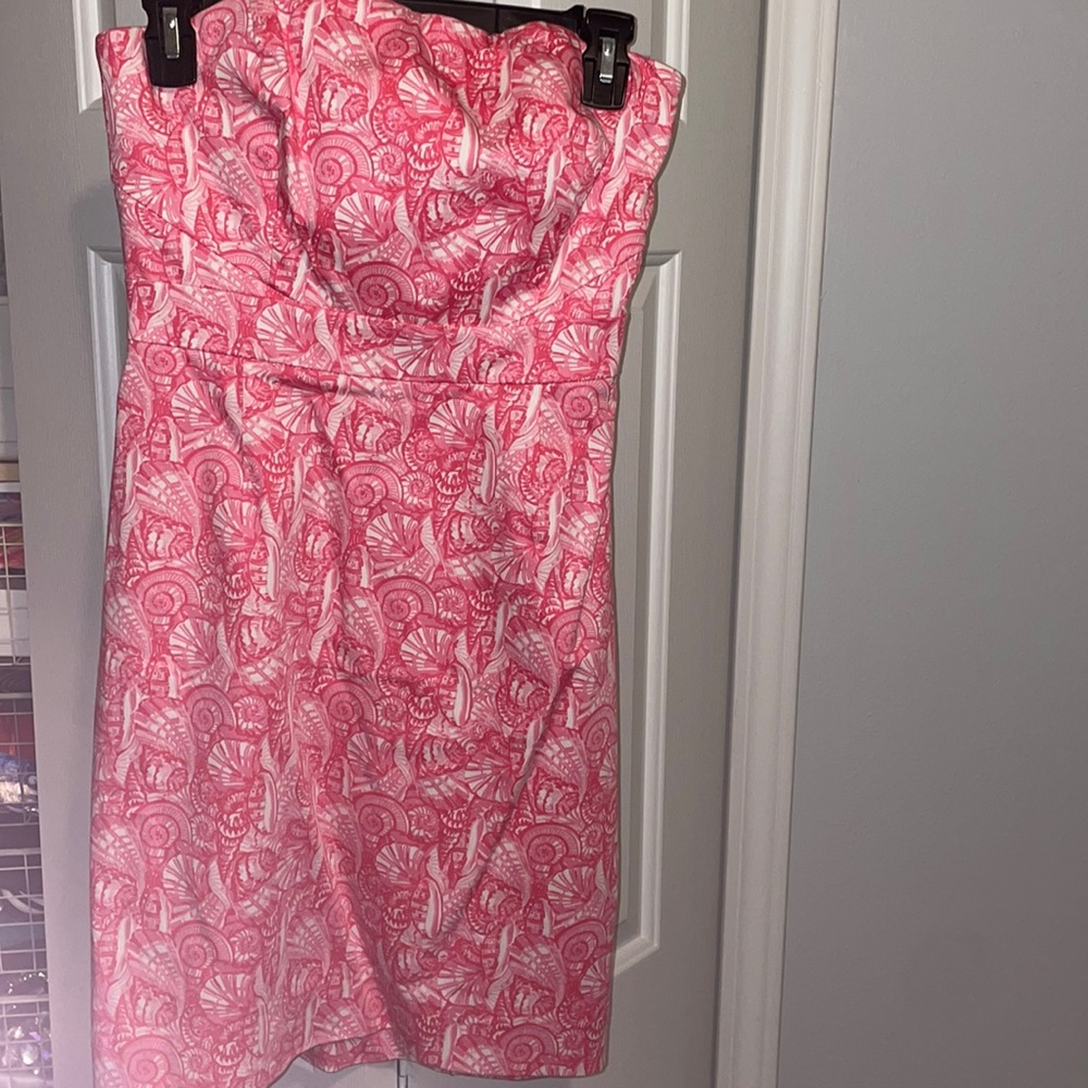 Pink sea shell strapless dress.